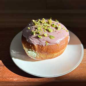 Filled donut with pistachios